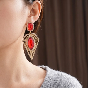 Vintage palace style gold earrings with large red crystals and sparkling micro-diamonds
