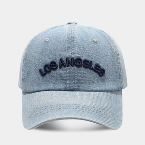 Close-up of Los Angeles 3D embroidery on vintage blue washed denim baseball cap