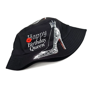 Black cotton bucket hat featuring Happy Birthday Queen text with rhinestone crown and heel