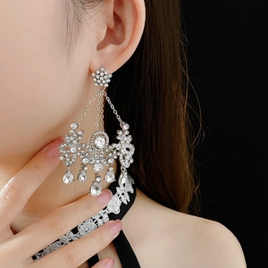 Close-up of vintage tassel earrings with sparkling rhinestones and crystal water drops