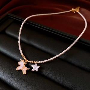 18K gold plated pearl necklace featuring white unicorn pendant and star zircon charm
