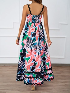 Detail view of the floral maxi dress featuring wavy black straps and a bohemian print