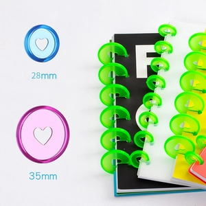 Colorful 28mm plastic discbound rings for mushroom hole notebooks in assorted vibrant colors
