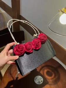 Vintage evening handbag with red 3D roses and pearl handle for formal events