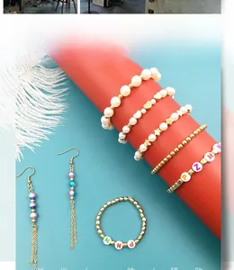 DIY jewelry kit with faux pearls, star charms and bead tassels on a contrast background