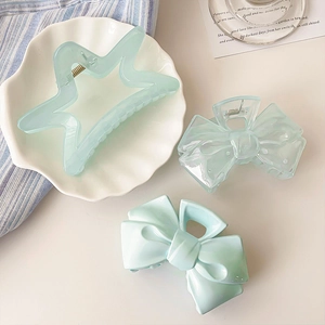 French cream blue bow and star hair claws in light acrylic for elegant hairstyling