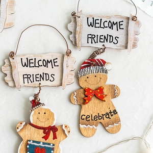Wooden gingerbread man Christmas ornament with Welcome Friends sign and hanging wire