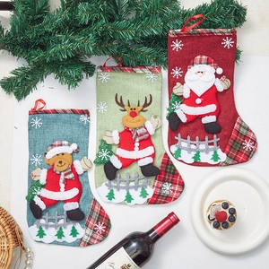 Set of three linen Christmas stockings with Santa, Reindeer and Bear 3D appliques