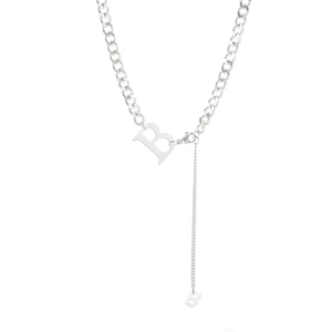 Silver Cuban chain necklace featuring a minimalist letter B pendant on a white background