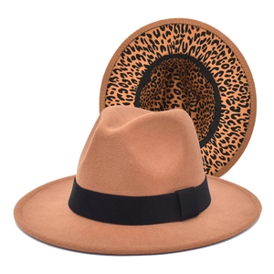 Detail of brown fedora hat with leopard print underbrim and black grosgrain ribbon