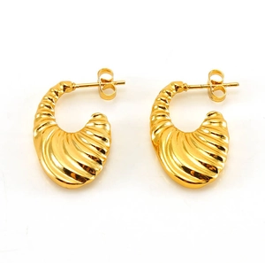 Macro view of 18K gold plated stainless steel U-shaped earrings with spiral textures