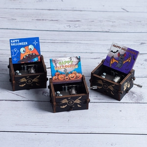 Hand-cranked wooden Halloween music box set with colorful spooky pumpkin and bat designs