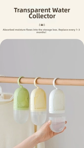 Hanging wardrobe dehumidifier detail showing transparent water collector and green hook