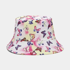 Reversible bucket hat with yellow and pink tie-dye butterfly print for sun protection