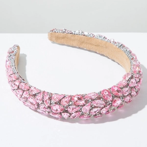 Detail of pink crystal rhinestones and soft suede lining on a baroque style headband