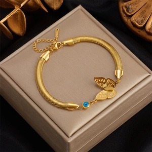 Golden stainless steel snake chain bracelet with butterfly and evil eye pendant charms