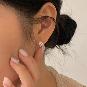 Minimalist 925 sterling silver hoop earrings with pavé zircon, worn by model