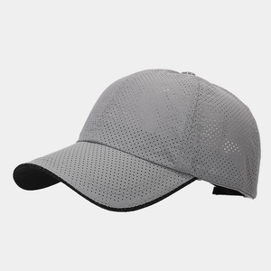 Close-up of gray quick-dry baseball cap featuring breathable mesh and black visor trim