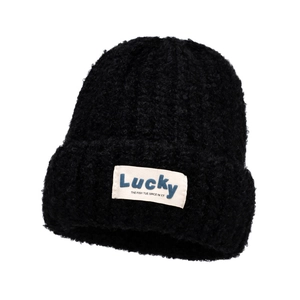Thick black teddy fleece knit beanie featuring a white Lucky woven label and soft texture