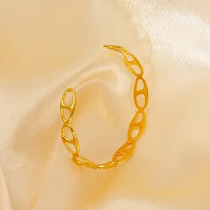 Elegant gold-tone adjustable open cuff bracelet with anchor link hollow design on silk fabric