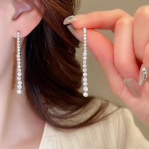 Elegant silver tassel earrings with vertical round cubic zirconia and pearls for women