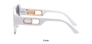 Side view of white oversized sunglasses featuring golden hollowed-out metal temples