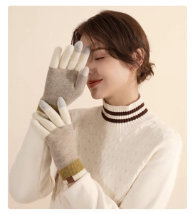 Detail of wool knit gloves featuring color-block design and touchscreen fingertips