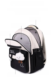 Macro view of water-resistant nylon backpack with multi-functional compartments and plush charm