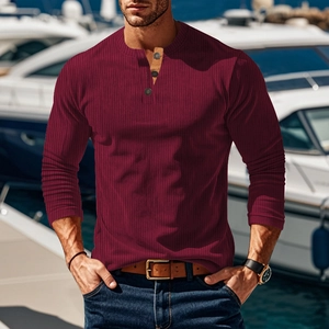 Close-up of ribbed knit texture and three-button neckline on a burgundy Henley shirt