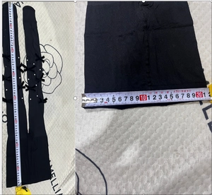 Detailed measurement of Lolita black stockings with bows and pearls against floral cloth