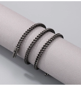 Detail of vintage grey stainless steel keel chain with secure clasp on a display prop