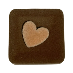 Brown velvet jewelry box featuring a light tan heart design on the top square lid