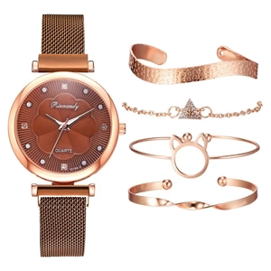 Rose gold magnetic quartz watch with four matching bracelets set on white background