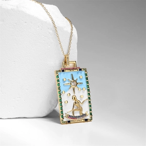 Gold-plated copper Tarot 'The Star' pendant necklace with zircon and enamel inlay on a stone