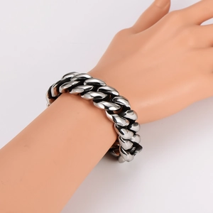 Polished silver stainless steel thick Cuban link chain bracelet in a minimalist style