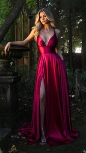 Detailed view of magenta satin gown featuring deep V-neck and high side leg slit