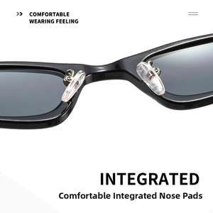 Detail of integrated transparent nose pads on black cat-eye sunglasses for comfortable wear