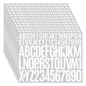 Macro view of white vinyl letter stickers with bold A-Z fonts for scrapbooking DIY