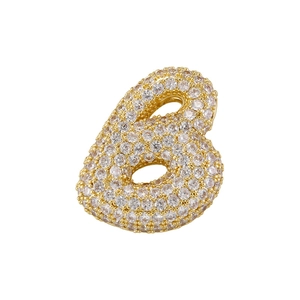 Close-up of golden number 6 pendant set with sparkling cubic zirconia on white background