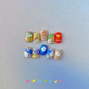 Detailed macro view of 5D embossed floral nail stickers with cute 3D sunflower designs