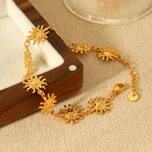 18K gold plated stainless steel sun anklet displayed on a wooden jewelry box