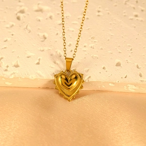 Gold stainless steel heart pendant necklace with sunburst texture on golden cable chain