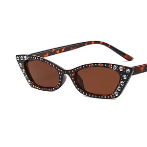 Fashionable cat-eye sunglasses with tortoiseshell frame and shimmering rhinestone trim