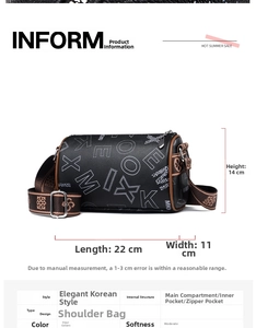 Detail view of a black Boston bag featuring white letter prints and brown printed straps