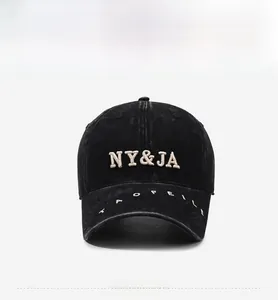 Detail of NY&JA 3D embroidery on black washed cotton vintage baseball cap