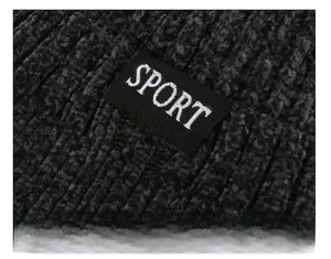 Close-up of SPORT letter patch stitched on dark gray thick knit winter beanie