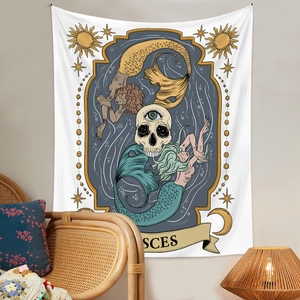Pisces astrology wall tapestry with skull and sun motifs hung in a cozy bedroom