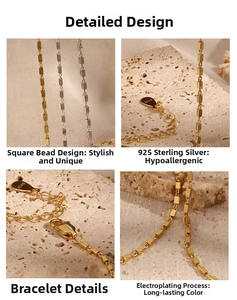 Detail of 925 sterling silver bracelets with small square beads in gold and silver finish
