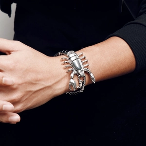 Close-up of a silver street style scorpion bracelet crafted from titanium steel on a wrist