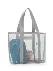 Macro view of grey mesh tote bag showing large capacity for flip-flops and essentials